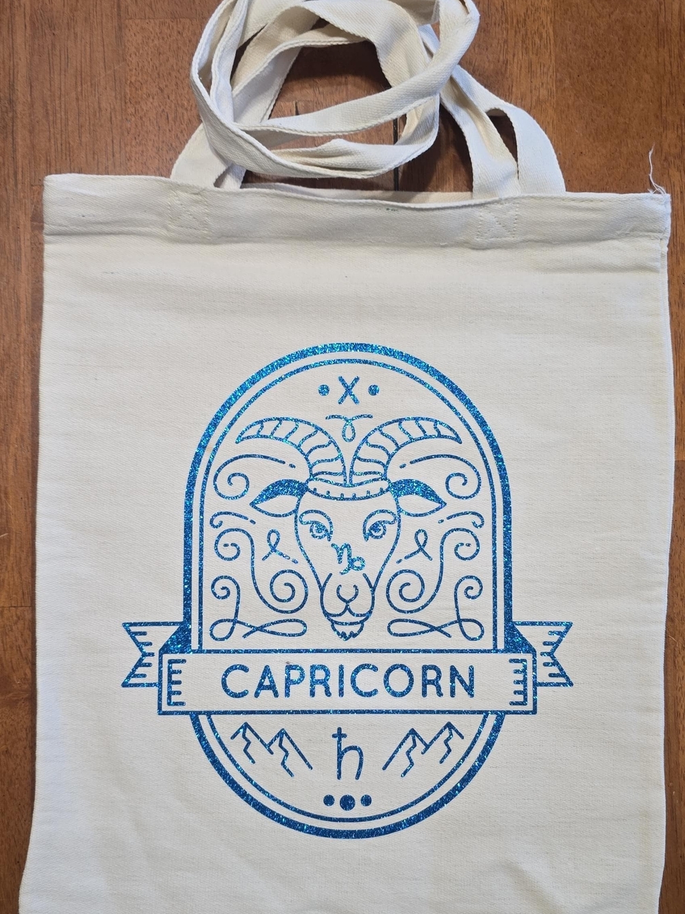 Capricorn Graphic Canvas Tote Bag - Natural with Blue Glitter Print